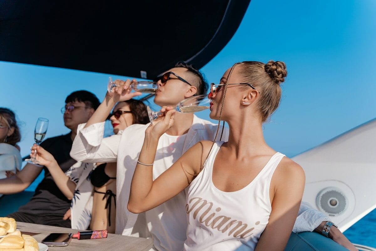 a group of people sitting at a table drinking wine