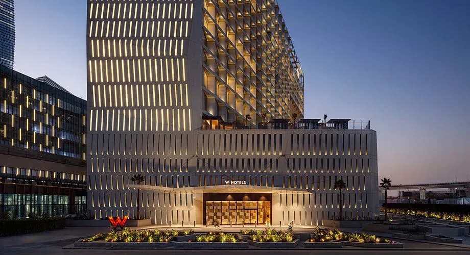 W Riyadh hotel exterior at dusk in the King Abdullah Financial District